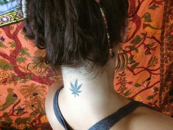 Daisy Haze’s marijuana leaf neck tattoo